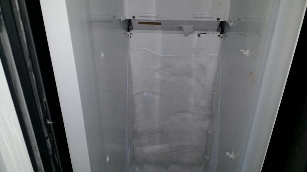 Frost covered back wall of GE refrigerator. - Click to Zoom Frost covered back wall of GE refrigerator.