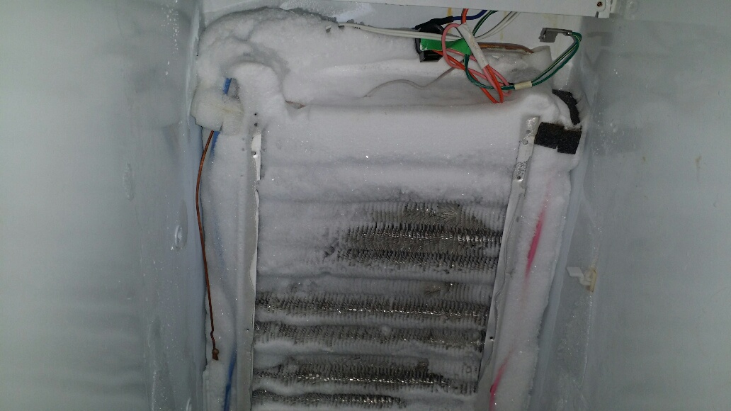 Totally iced up evaporator coils. - Click to Zoom Totally iced up evaporator coils.